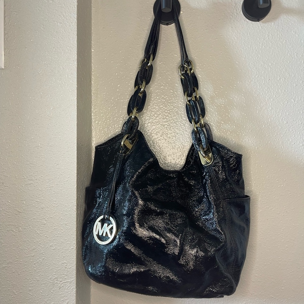 Michael Kors hobo bab with gold accents.